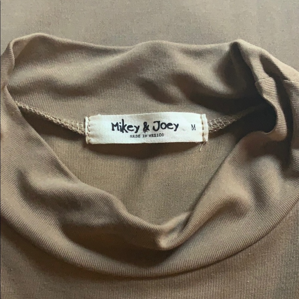 Super cute, slits, tan, never worn!